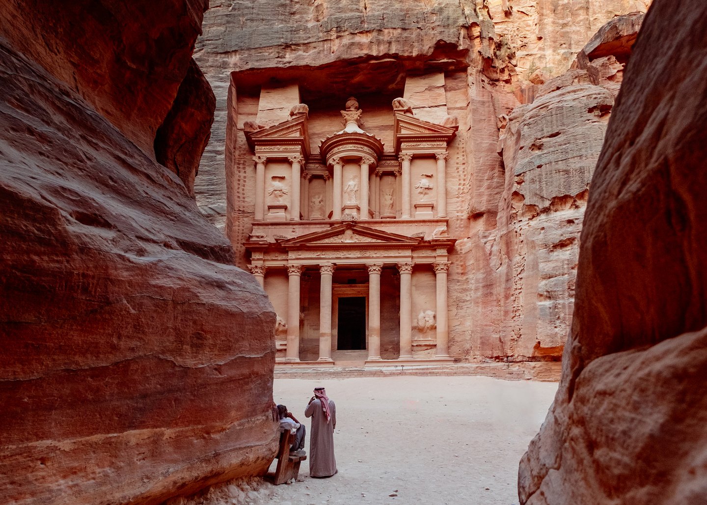 Two men at Al Khazneh at the ancient site of Petra in Jordan.