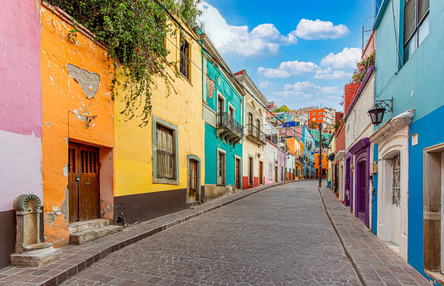 Colourful buildings lining a street in Guanajuato City, Mexico.