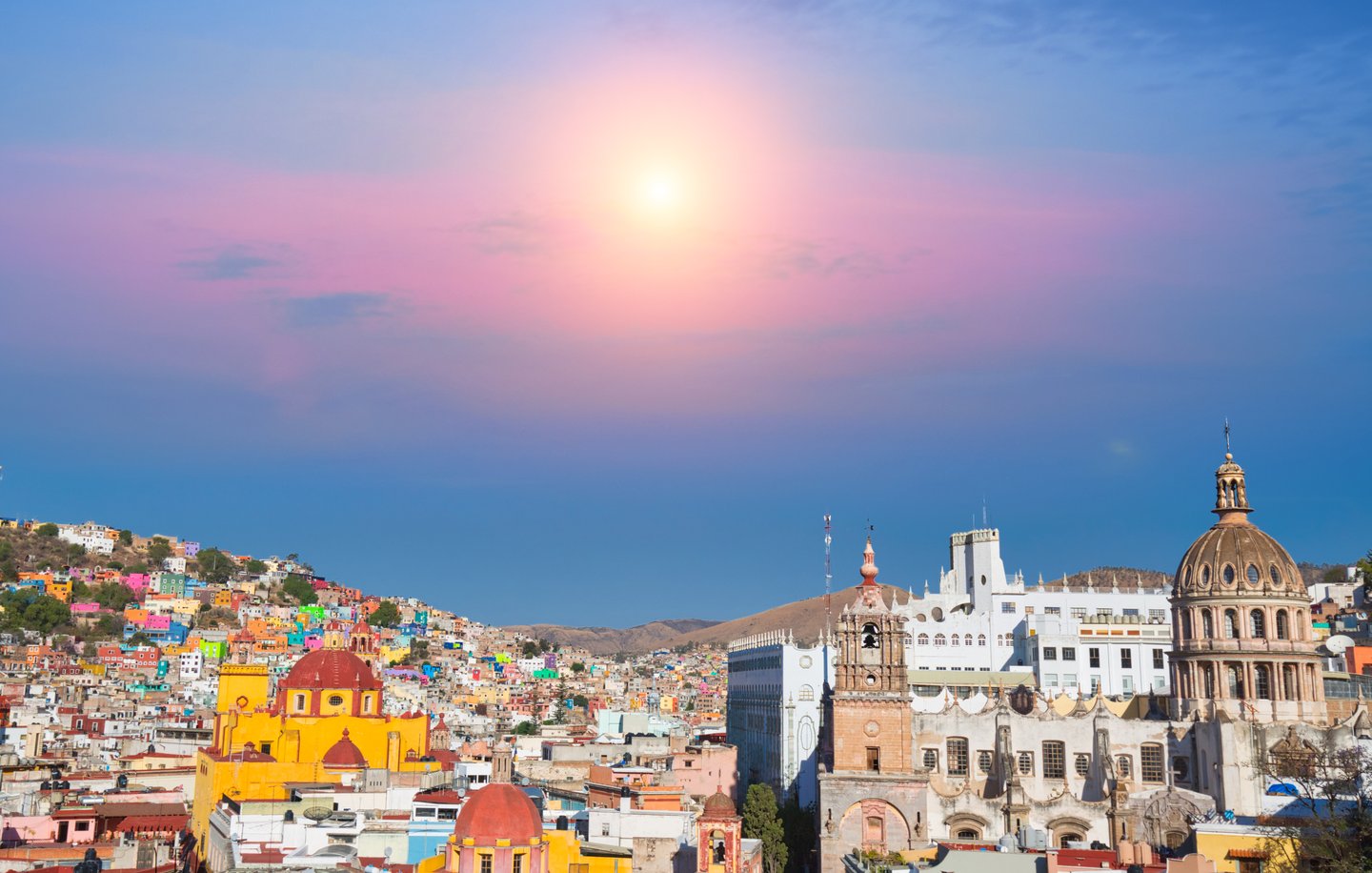 Buildings on the hills of Guanajuato City at sunset.