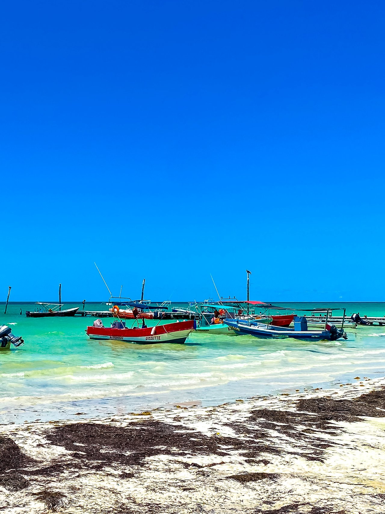 Colourful boats on the water in Holbox, Mexico