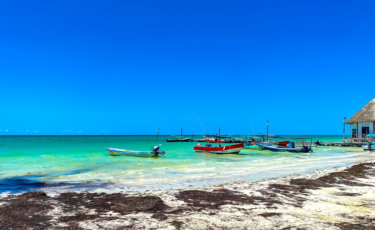 Colourful boats on the water in Holbox, Mexico