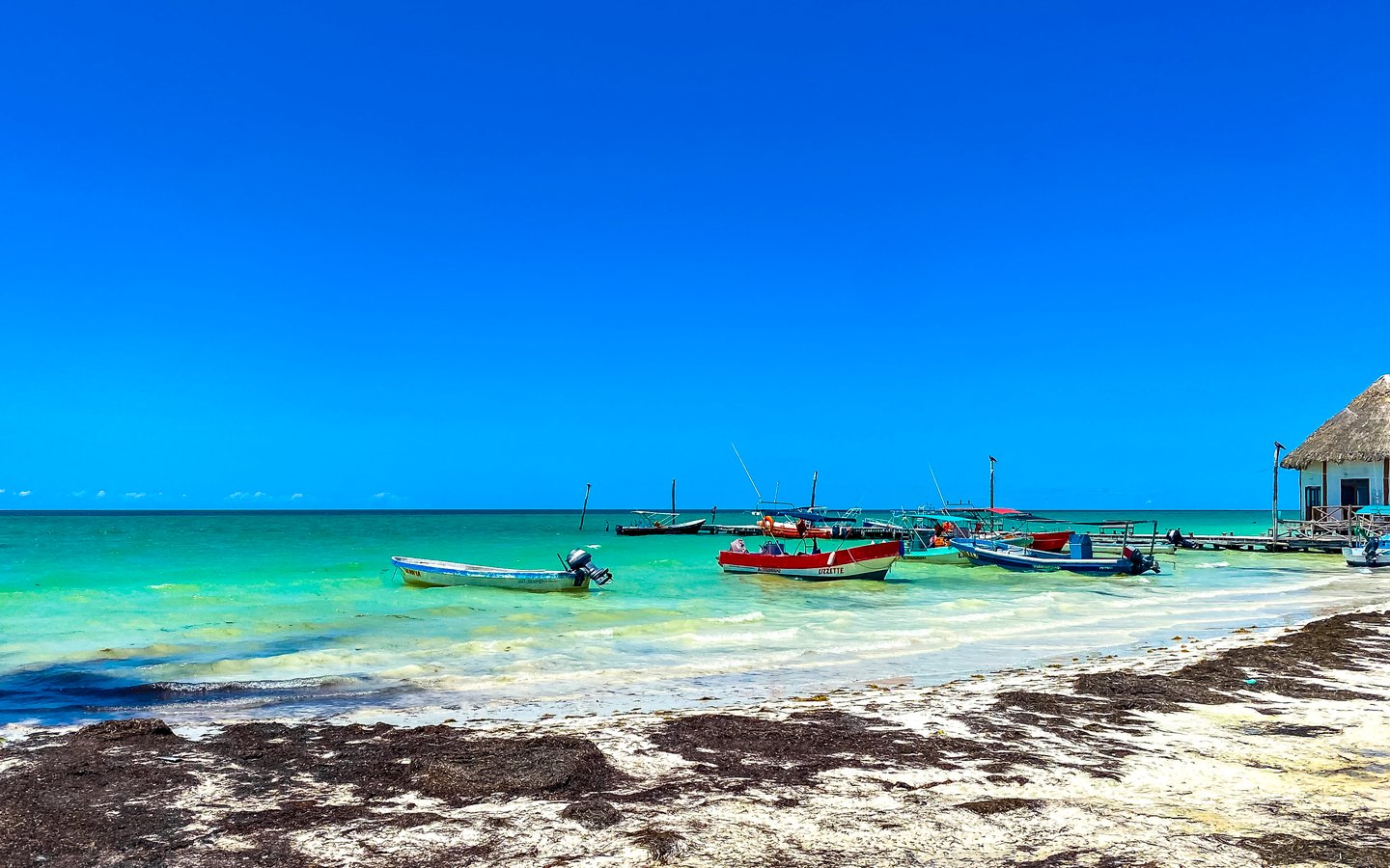 Colourful boats on the water in Holbox, Mexico