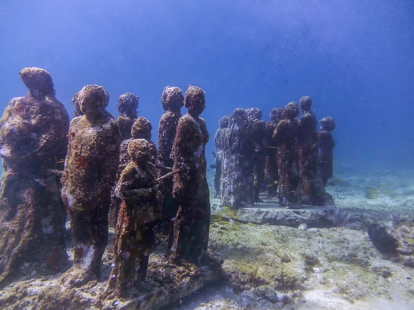 Statues in the Museum of Underwater Art in Isla Mujeres, Mexico