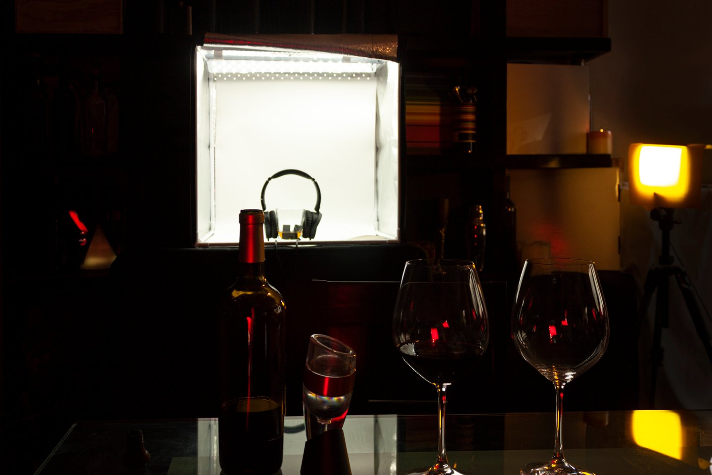 Wine glasses with head phones in the background in a bar in Mexico City