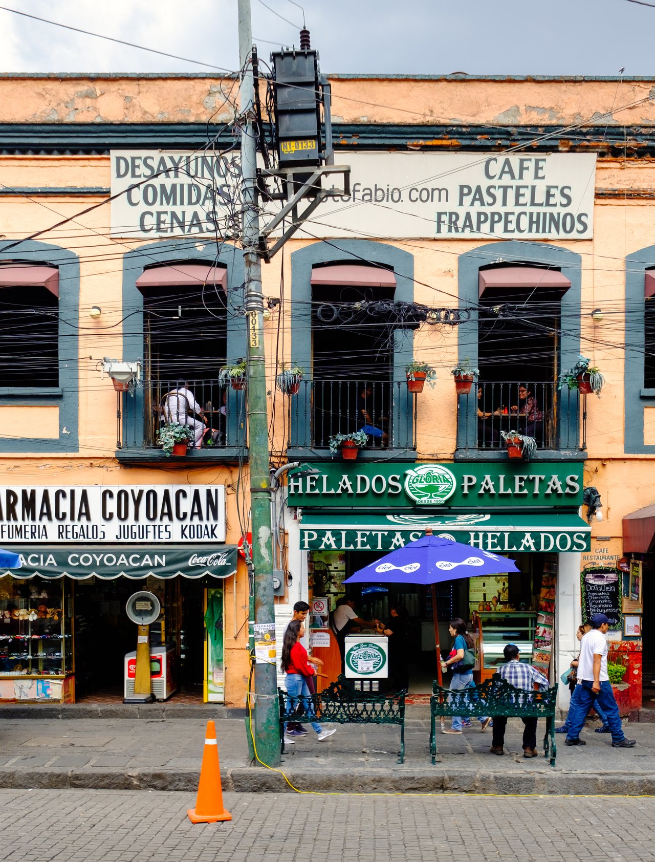 Local businesses at a colourful colonial building in Coyoacan, a historic neighbourhod in Mexico City.