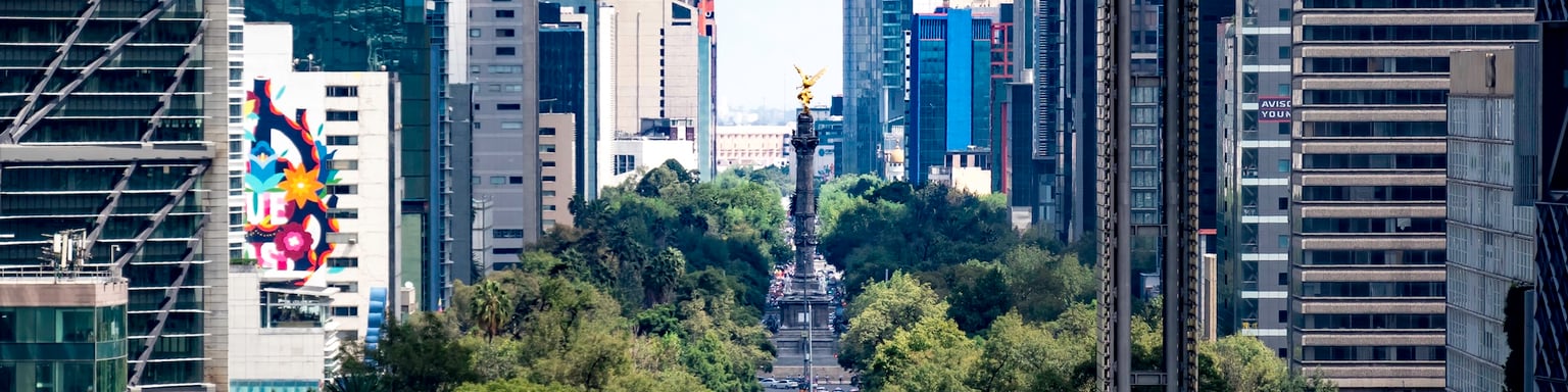 View of Paseo de la Reforma nested between skyscrapers in Mexico City