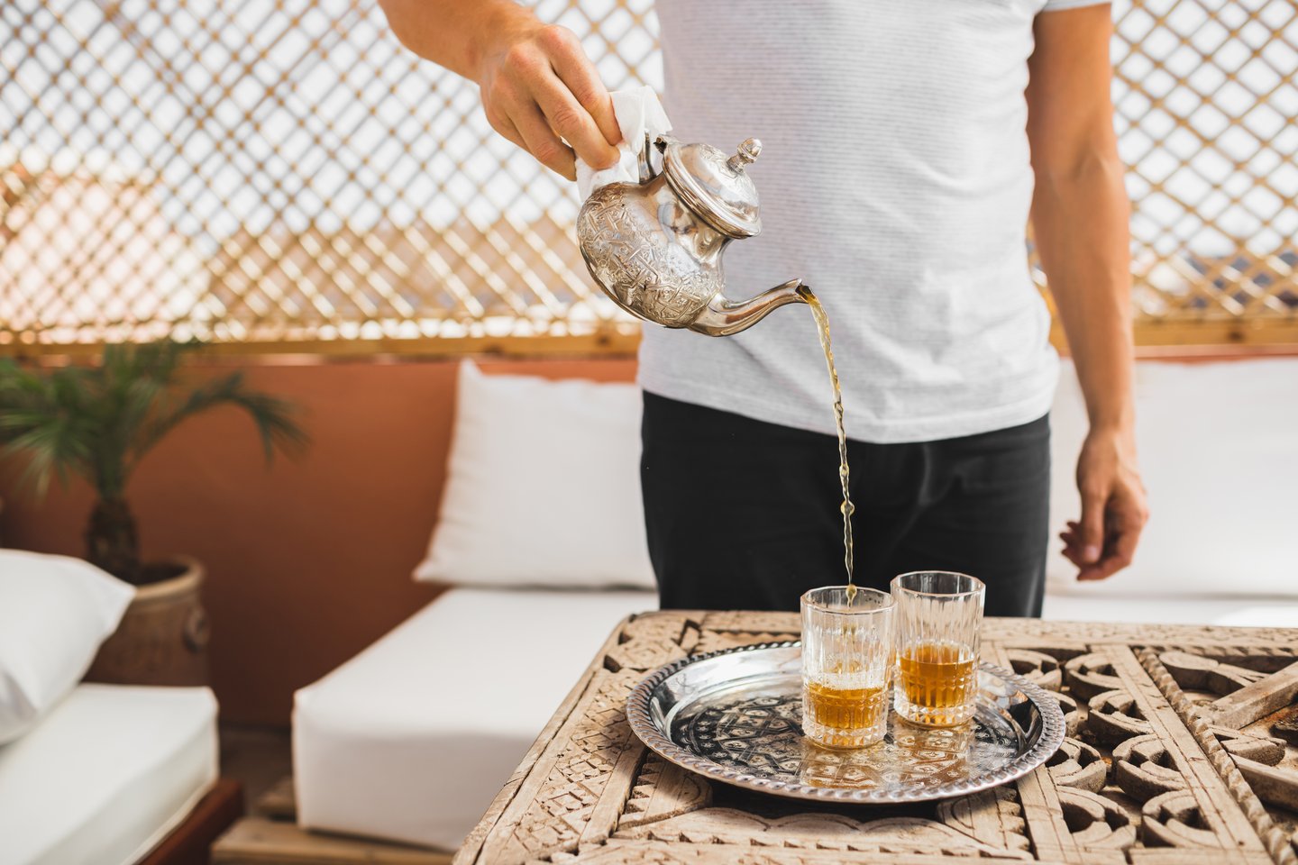 A man pouring mint tea in Morocco