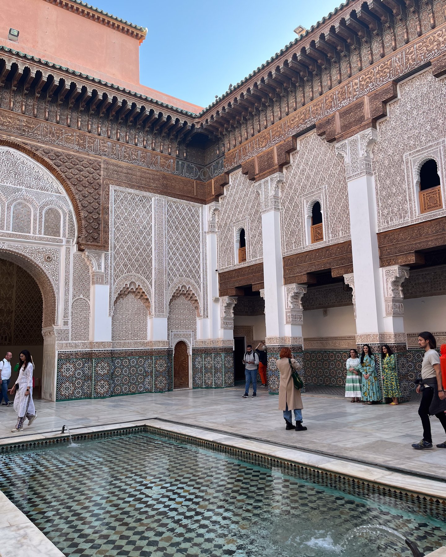 Ornate architecture inside the Ben Youssef Madrassa in Marrakech, Morocco