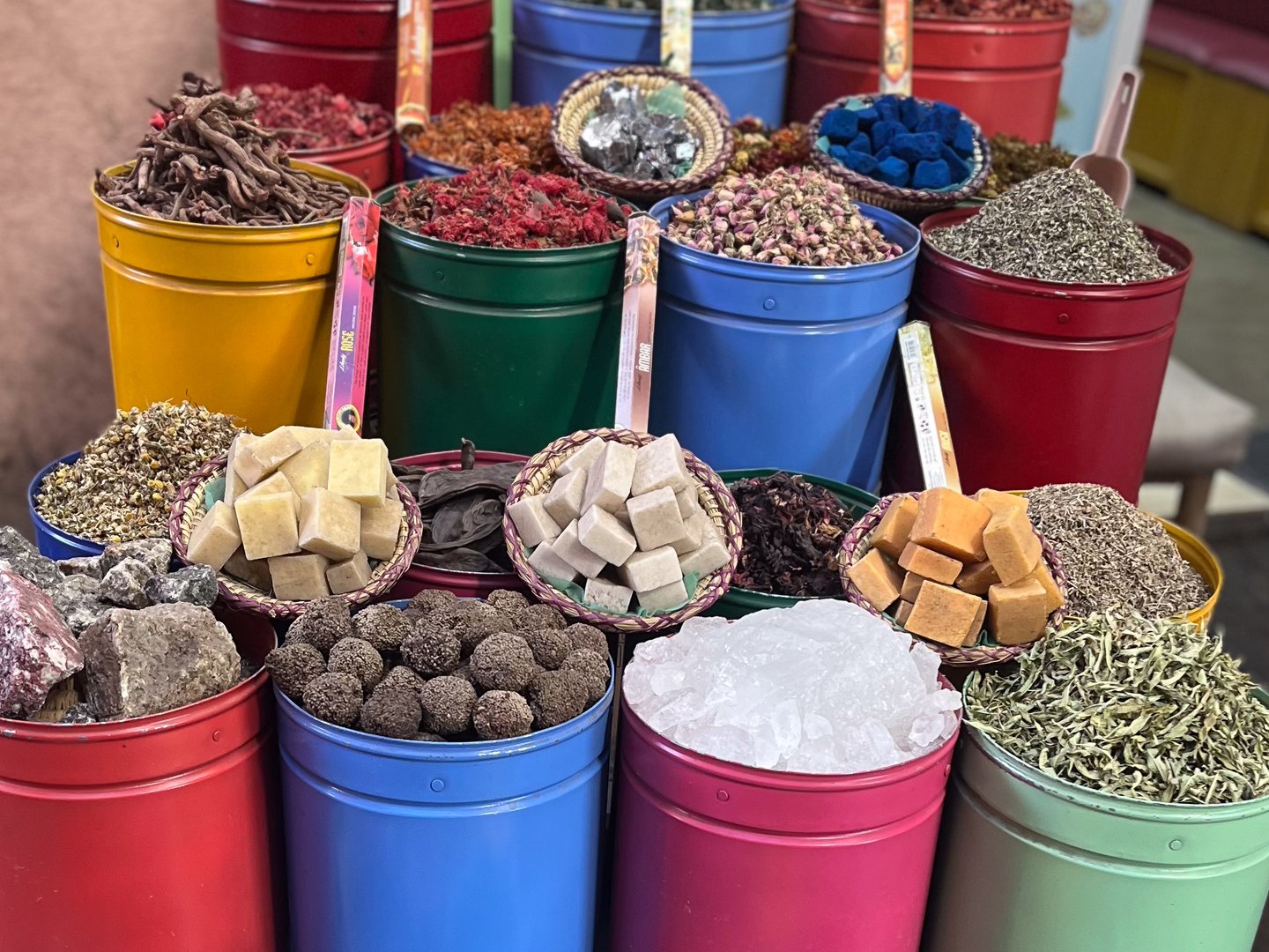Containers of spices and treats at a shop in Morocco