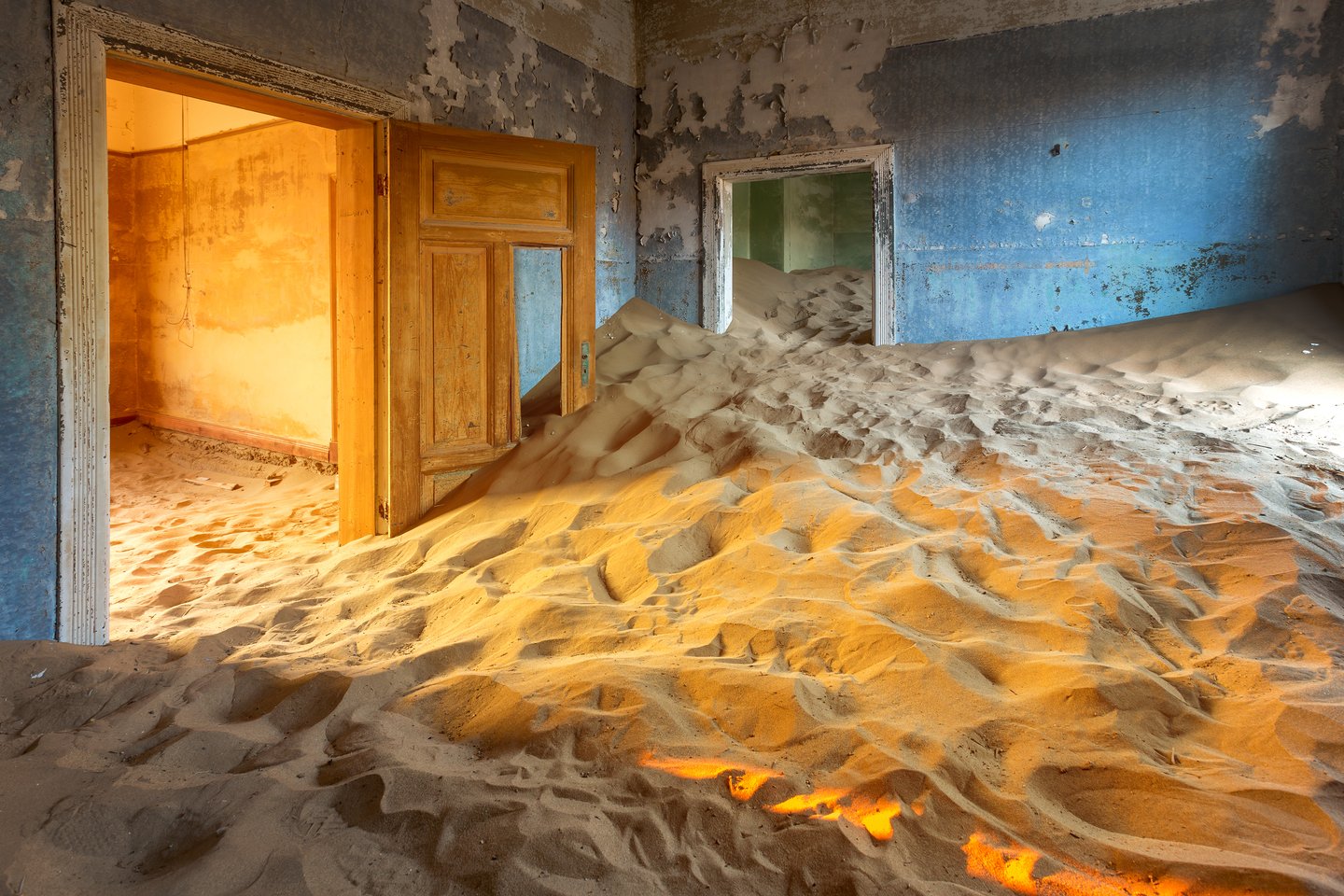 Sand fills the houses of the deserted town of Kolmanskop in Namibia.