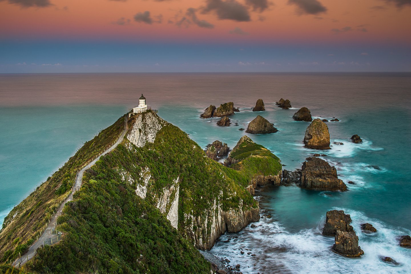 Nugget Point Lighthouse on the edge of the cliff in the Catlins, New Zealand
