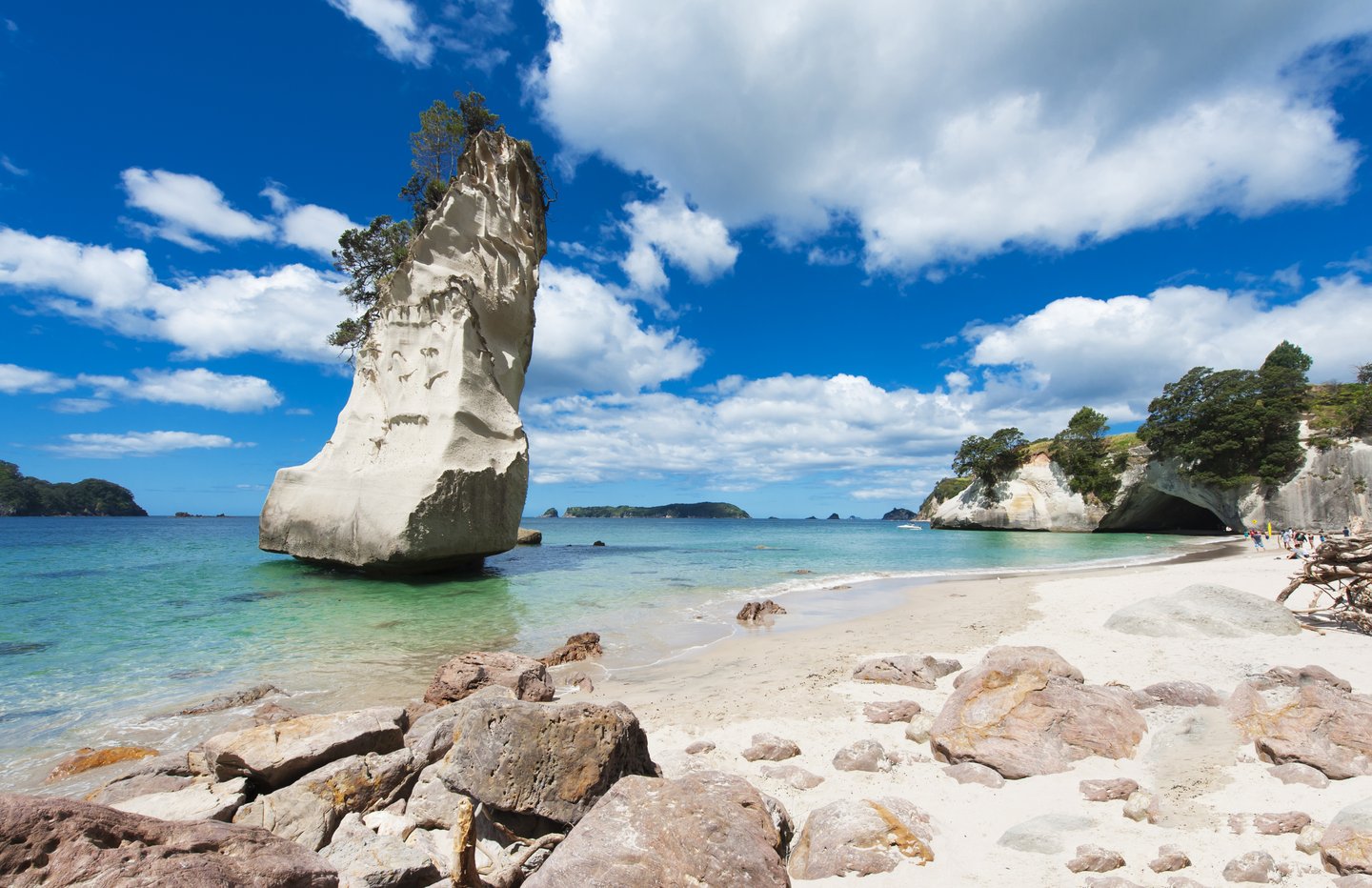 Rock formations on a sunny day at Cathedral Cove, New Zealand
