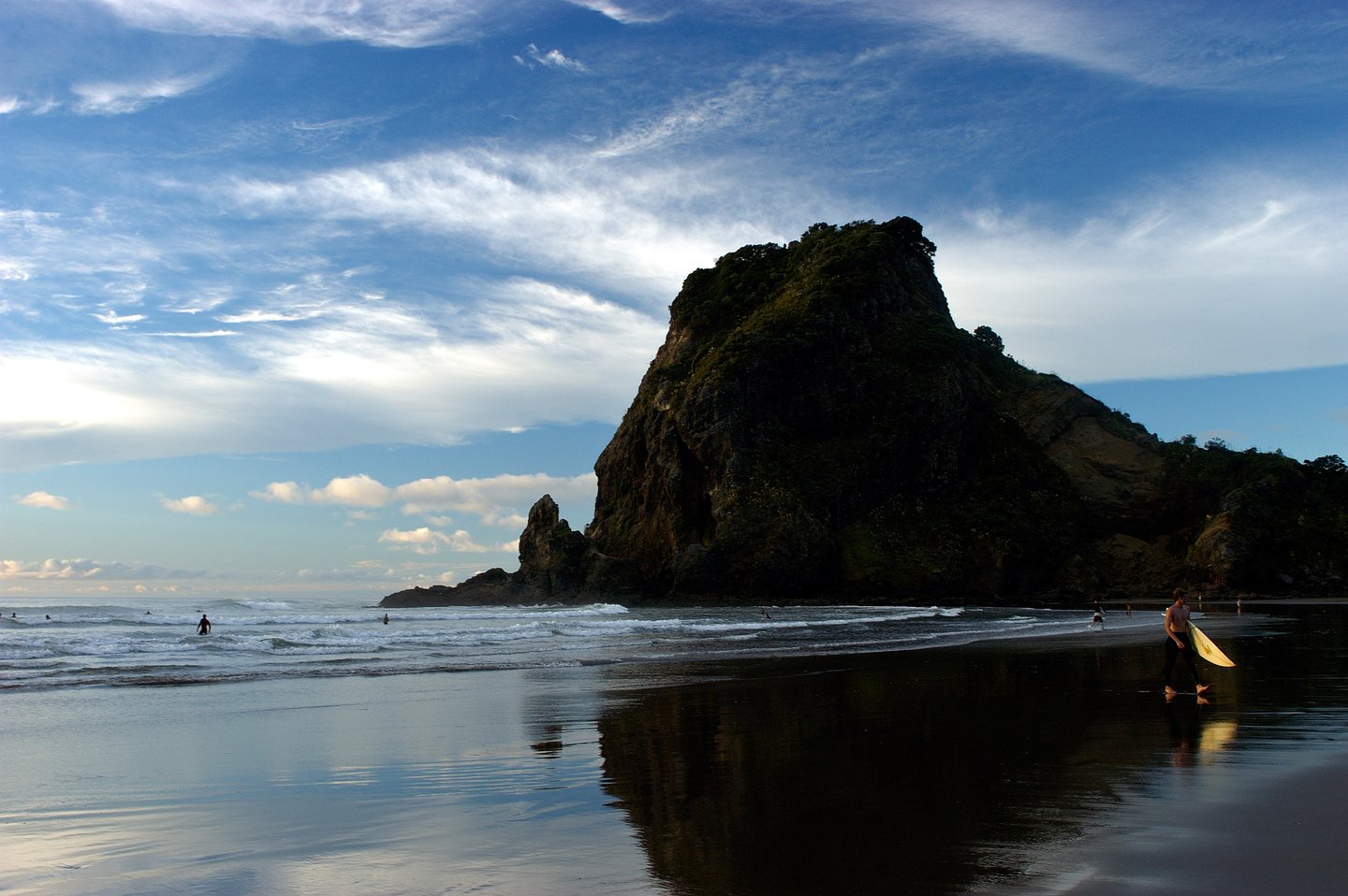Blue skies and black sand at Piha Beach.
