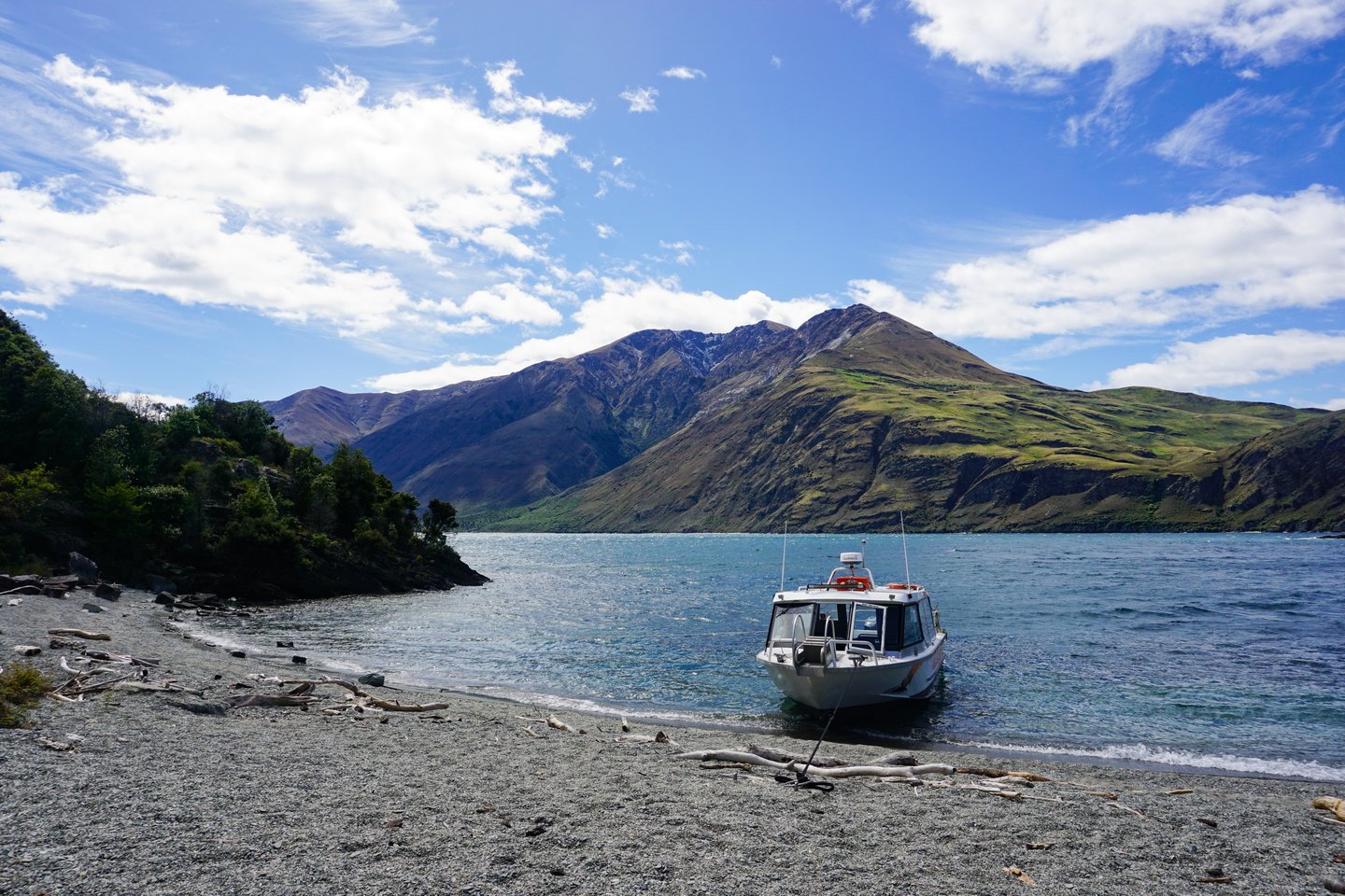 A small boat on the beach at Mou Waho Island, Wanaka