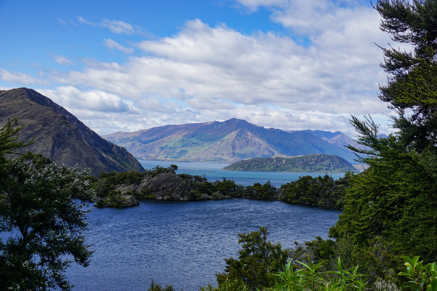 The view of Arethesa Pool, Lake Wanaka and mountains from the viewpoint on Mou Waho, New Zealand