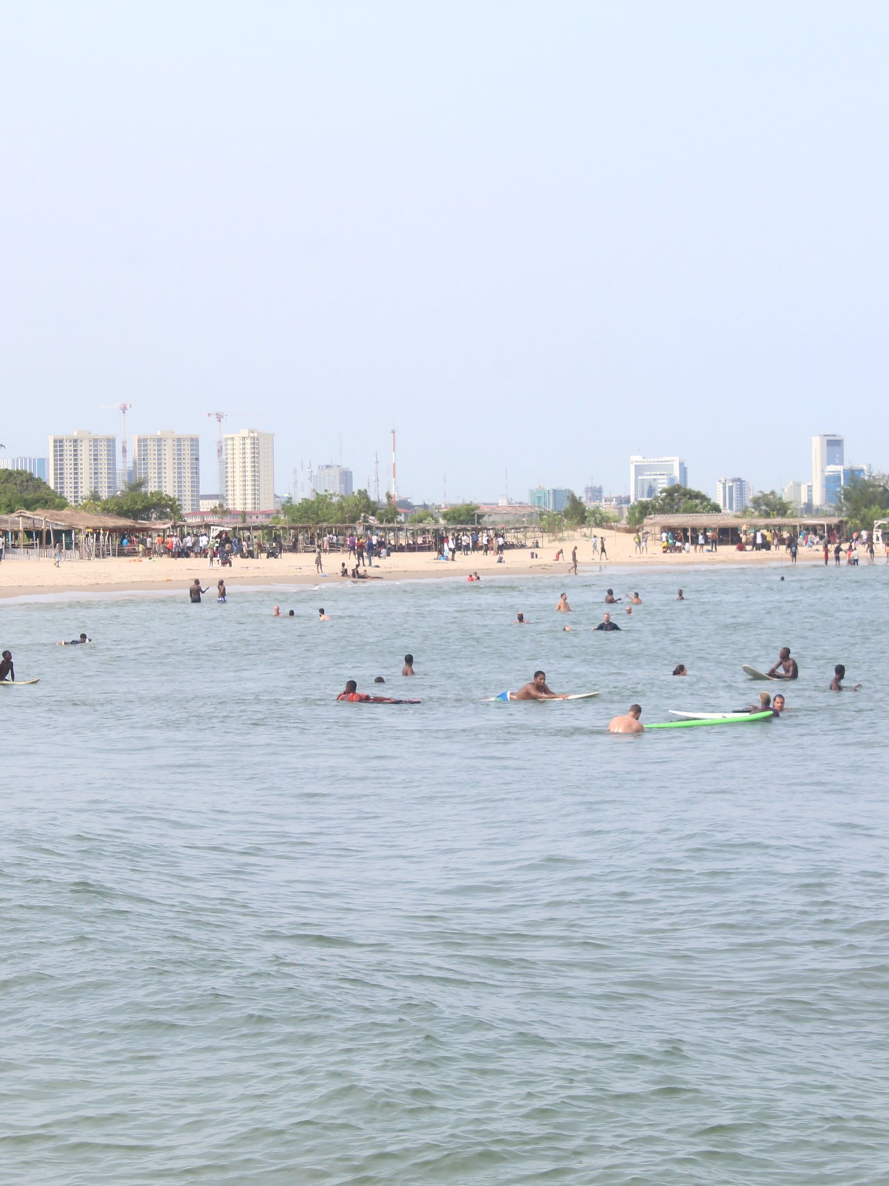 People swimming at Takes Bay beach , Lagos, Nigeria