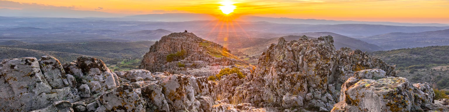 The sun setting over the ancient site of the Kokino Observatory in North Macedonia