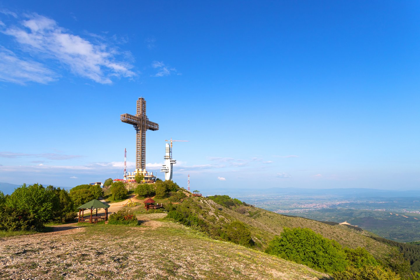 The Millennium Cross of Skopje perched on a hill in North Macedonia.