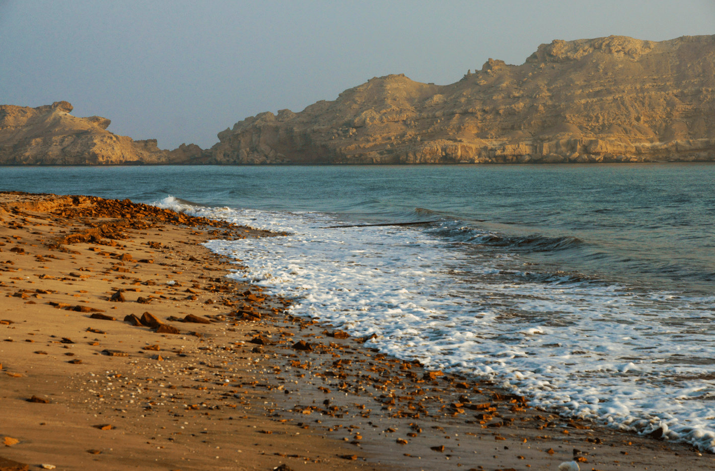 Al Sawadi Beach with the mountains in the distance