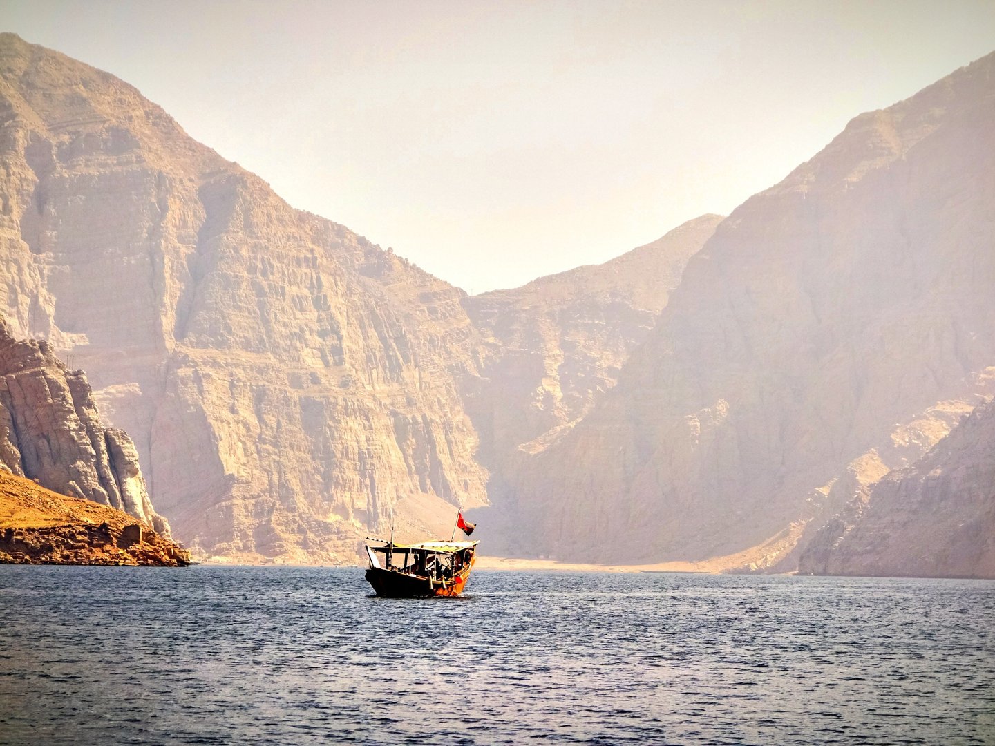 A traditional dhow boat in the fiords in Musandam, Oman