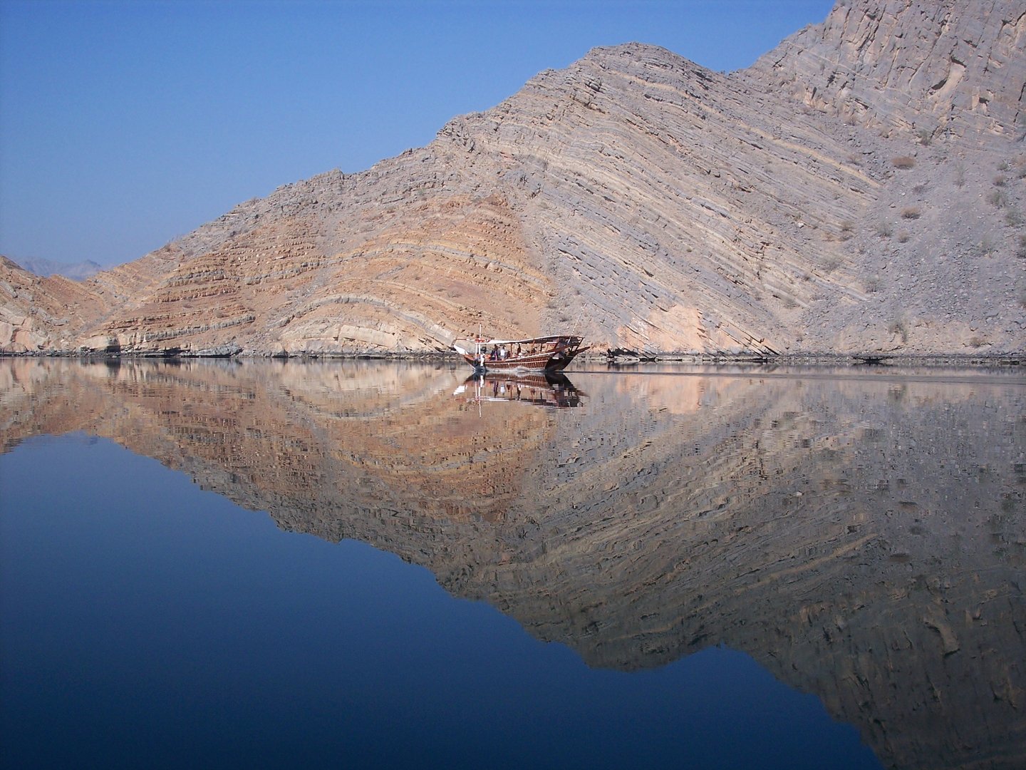 A dhow cruising in the Musandam fjords in Khasab, Oman.
