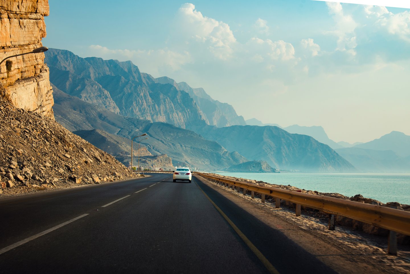 Driving along a scenic Khasab coastal road in Musandam
