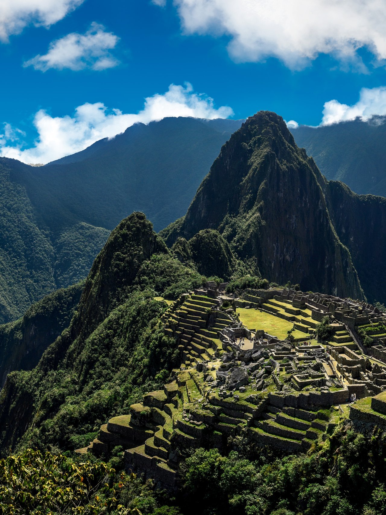 Panoramic view of Machu Picchu nestled in the mountains
