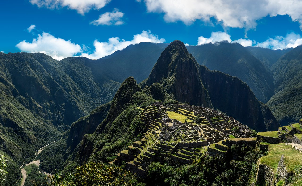Panoramic view of Machu Picchu nestled in the mountains