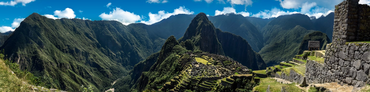 Panoramic view of Machu Picchu nestled in the mountains