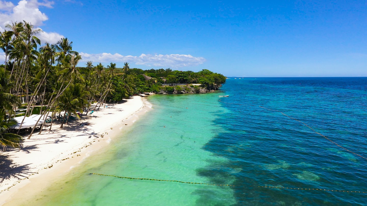 Sandy beach and palm trees on Panglao island, Bohol in the Philippines
