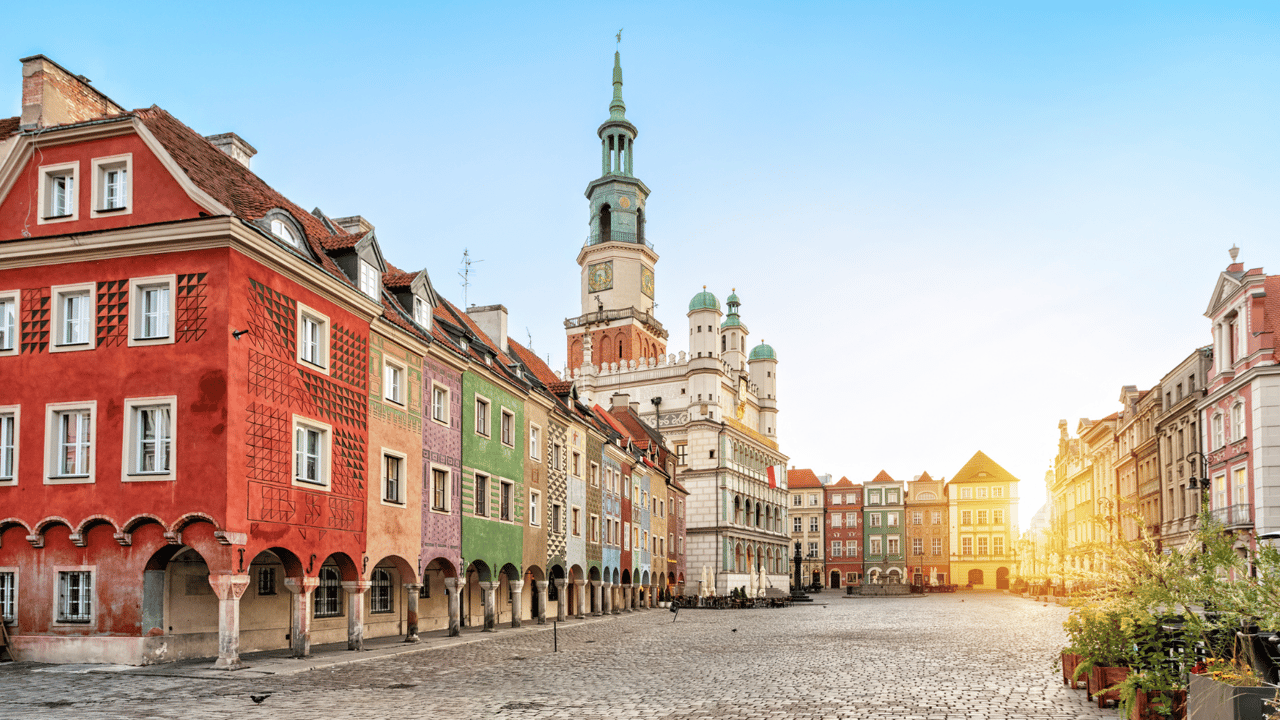  Rynek square with small colorful houses and old Town Hall in Poznan, Poland
