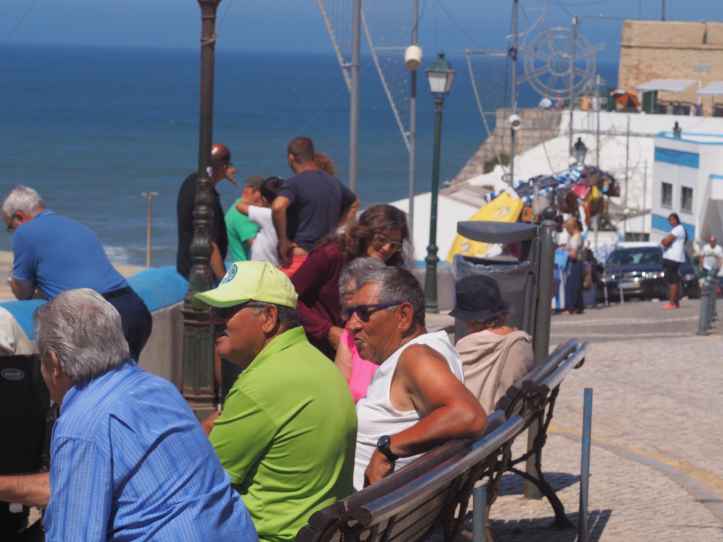 Men sitting on a bench in Ericeira, Portugal