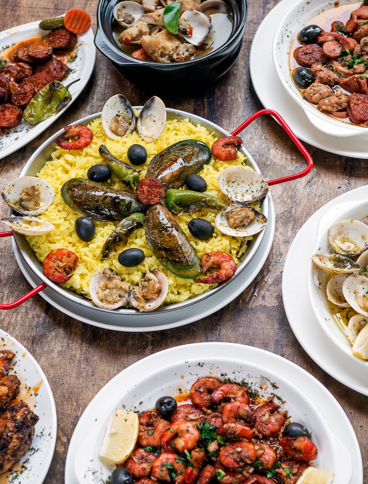 A selection of Portuguese dishes on a wooden table