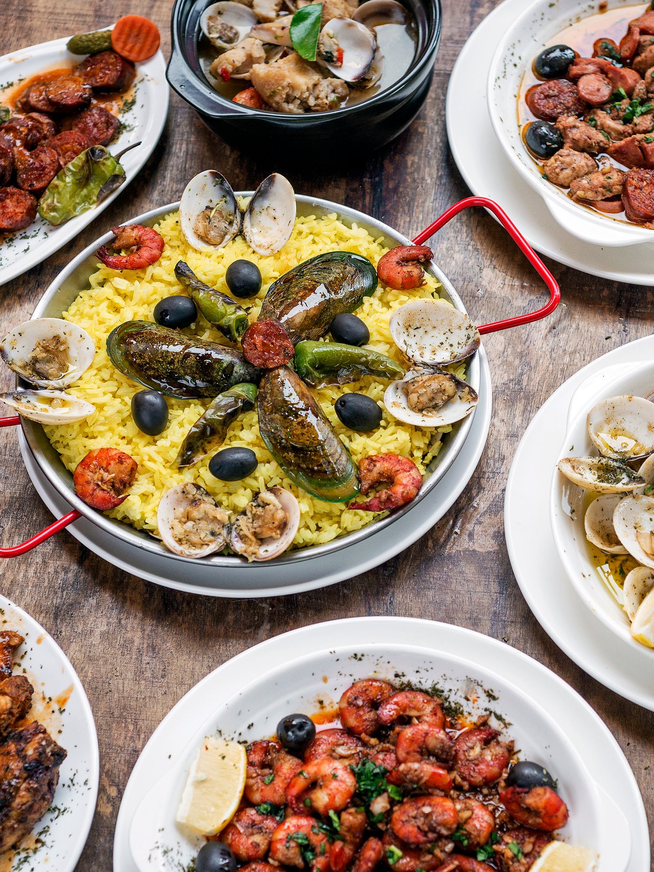A selection of Portuguese dishes on a wooden table