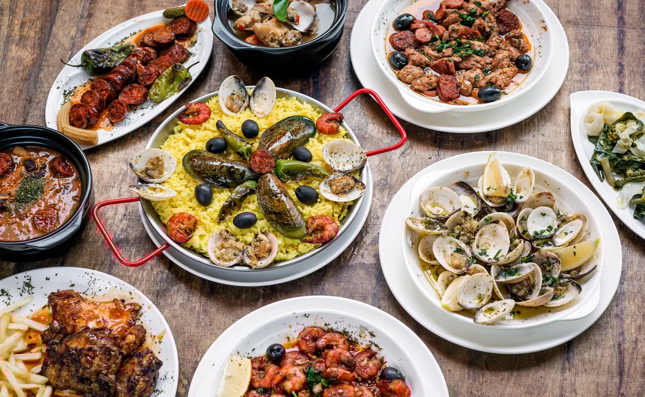 A selection of Portuguese dishes on a wooden table
