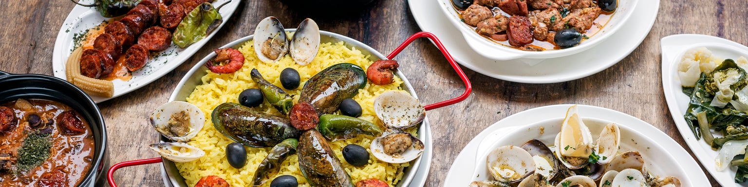A selection of Portuguese dishes on a wooden table