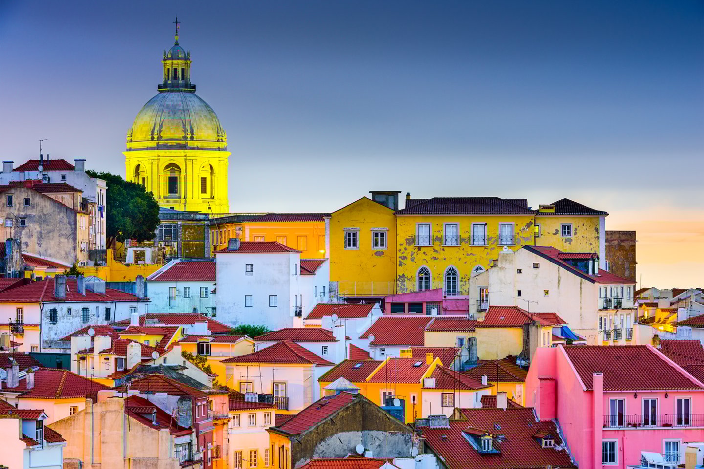 The charming skyline of the Alfama area in Lisbon at dusk