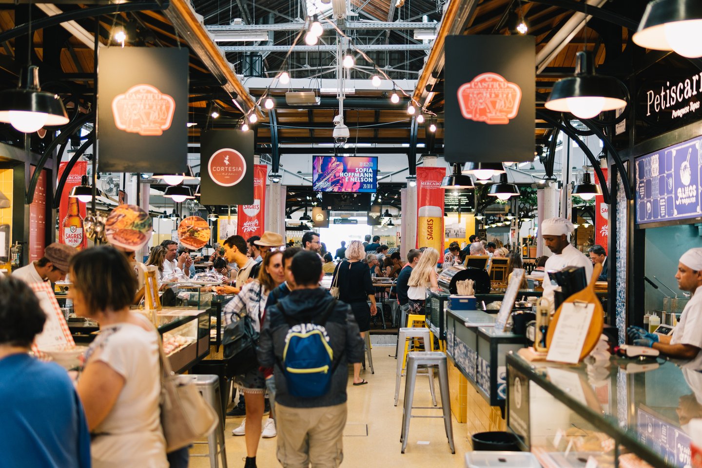 People shopping at Campo de Ourique Market in Lisbon