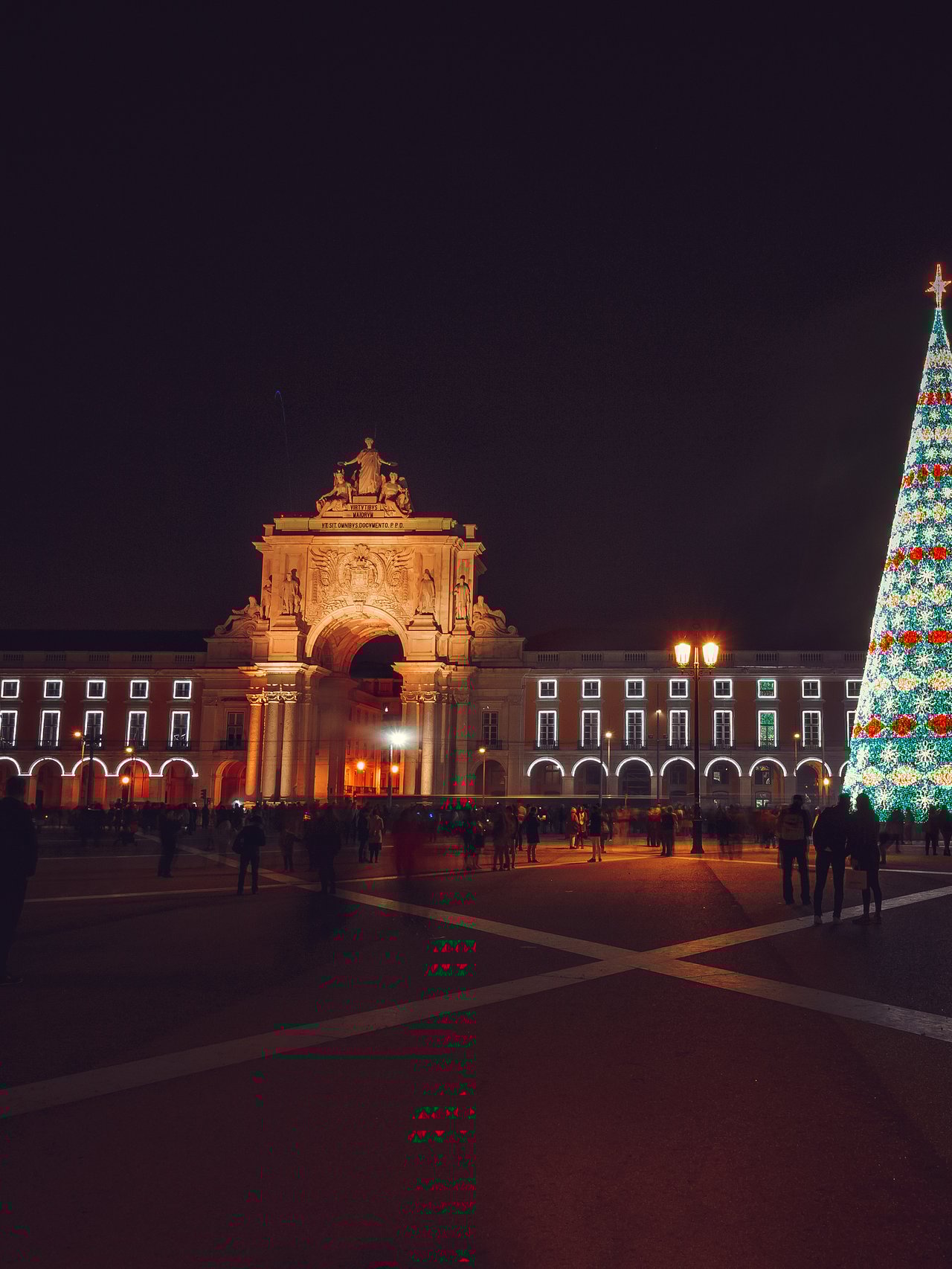 Christmas tree on Commerce Square at night in Lisbon, Portugal
