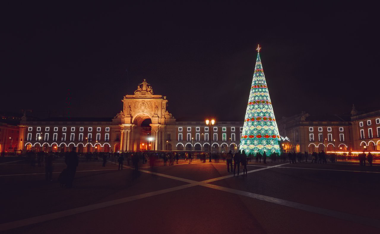 Christmas tree on Commerce Square at night in Lisbon, Portugal
