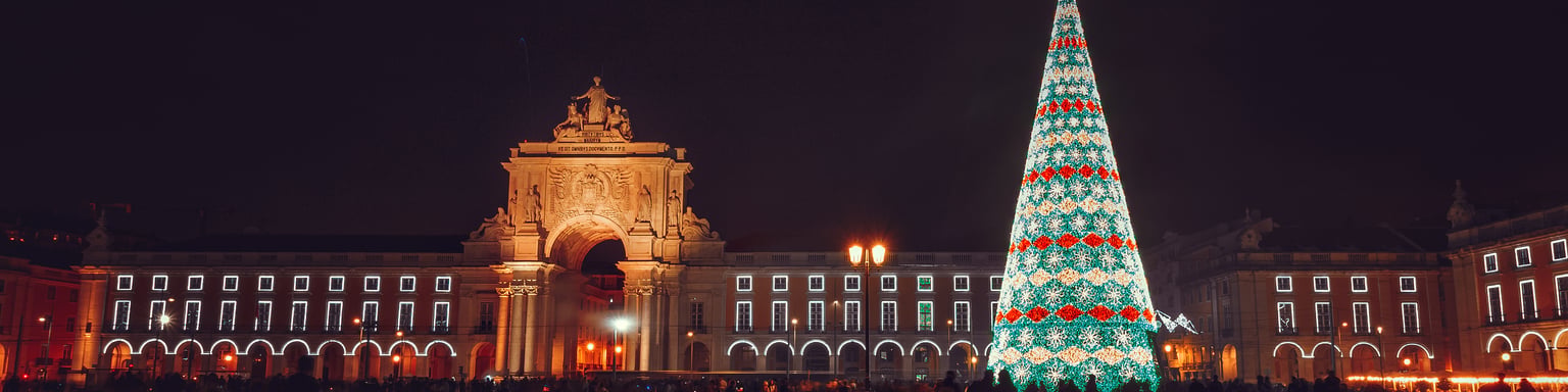 Christmas tree on Commerce Square at night in Lisbon, Portugal