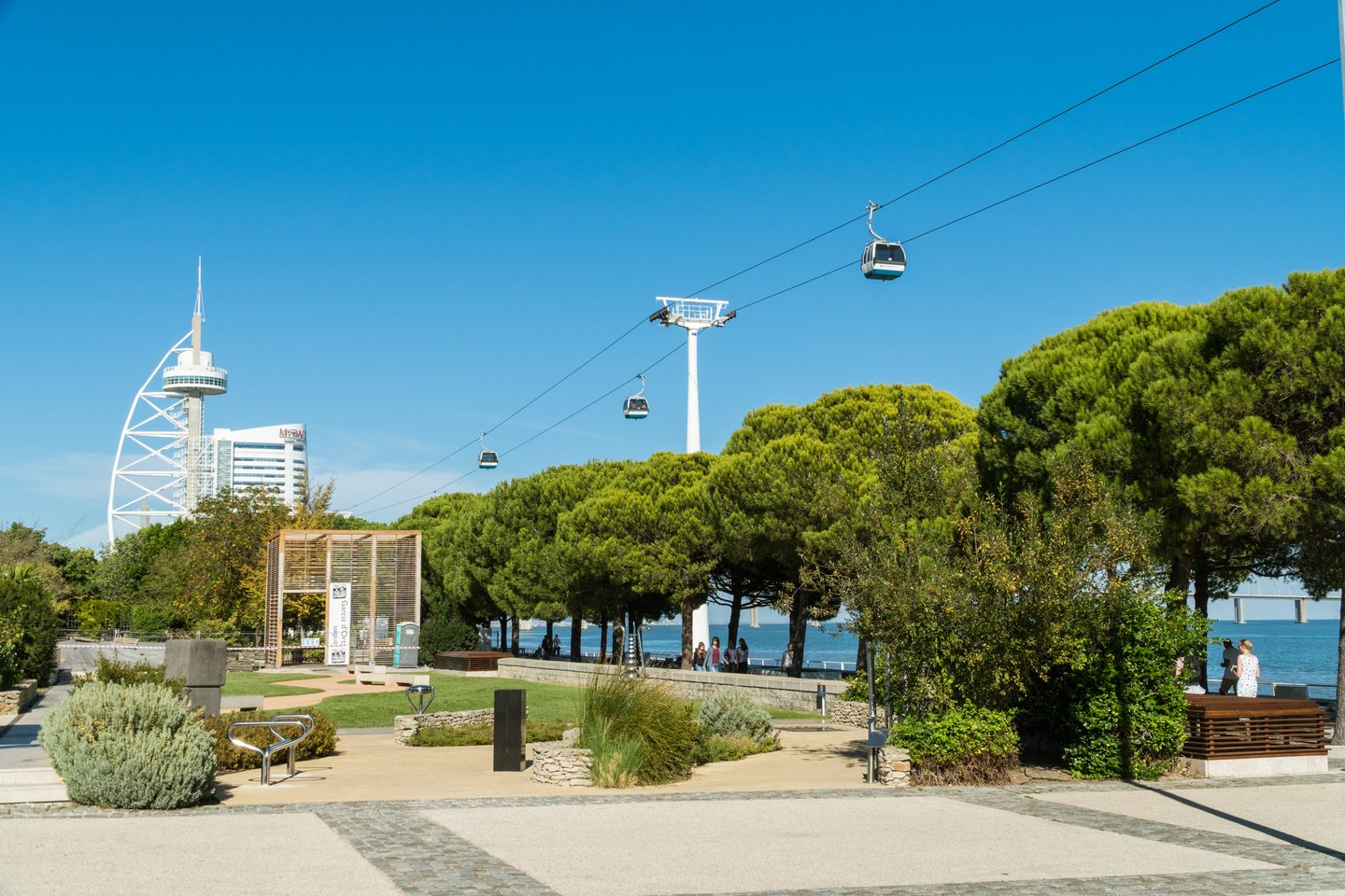 Cable cars over Passeio das Tagides park and Tagus river at Park of Nations (Parque das Nacoes) in Lisbon
