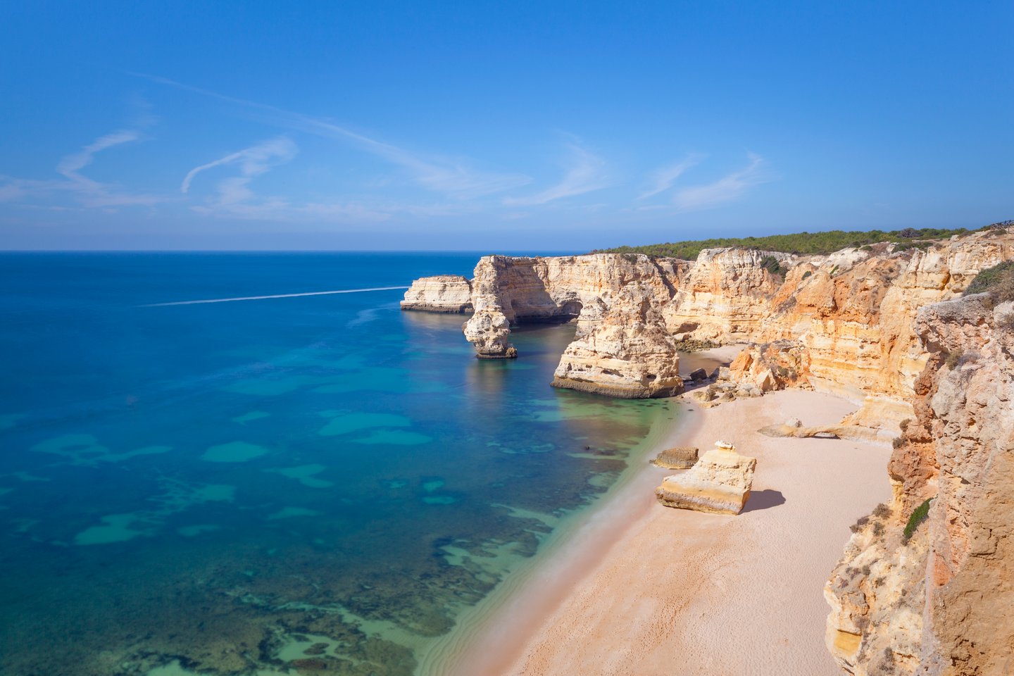 The white, sandy Marinha Beach in Portugal