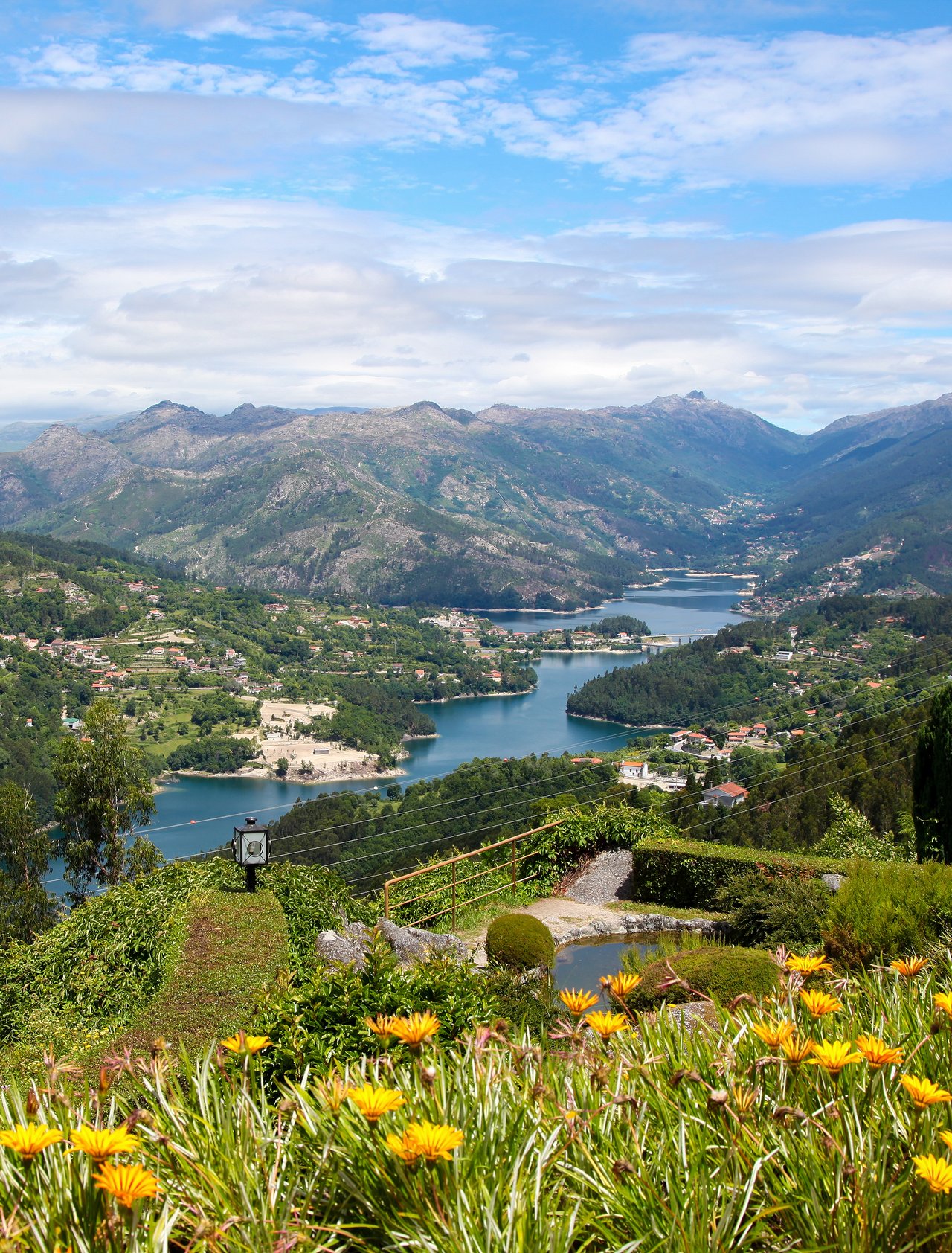 Colourful flowers and a river view at Parque Nacional Peneda-Gerês in Portugal