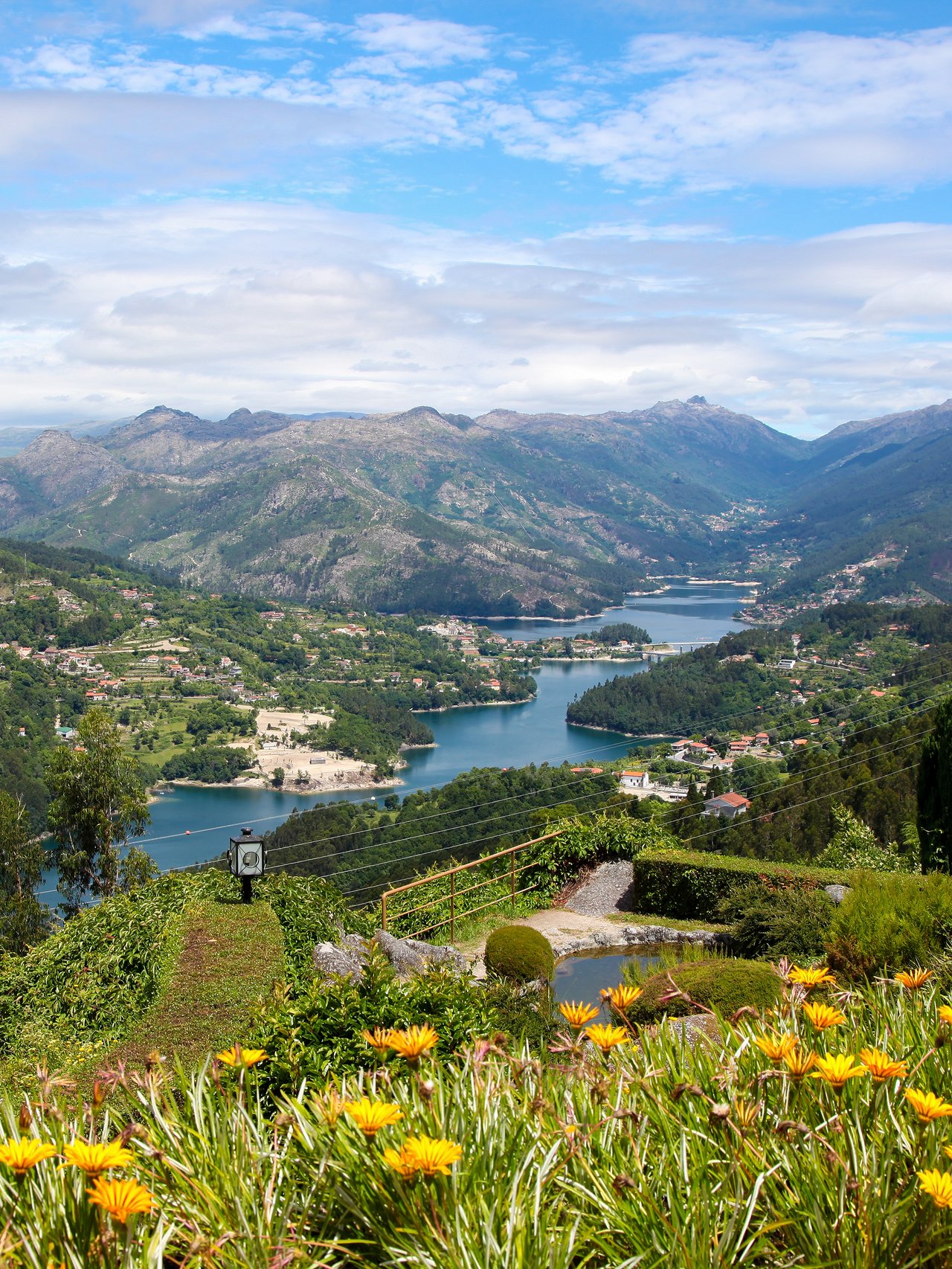 Colourful flowers and a river view at Parque Nacional Peneda-Gerês in Portugal