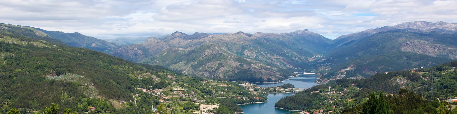 Colourful flowers and a river view at Parque Nacional Peneda-Gerês in Portugal