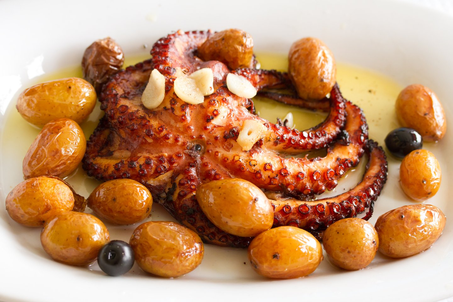 Polvo à Lagareiro, roasted octopus covered in olive oil and served with potatoes