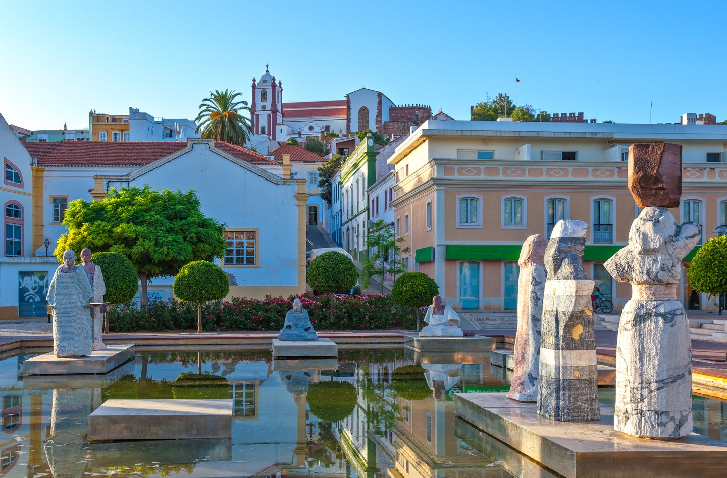 Statues in a pool in the Praca al Mutamid in Silves, Portugal