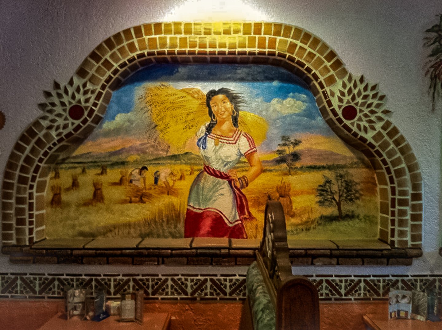 A mural of a woman in a wheat field