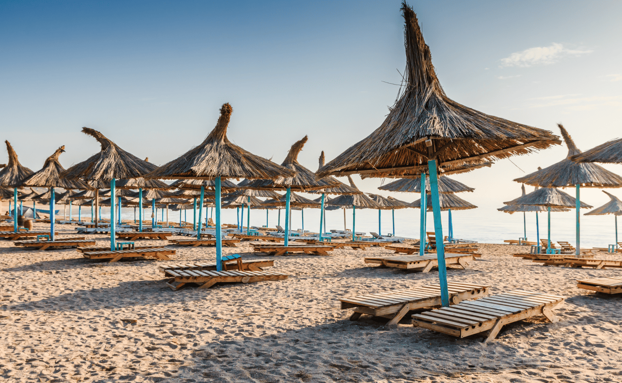 Straw umbrellas on the beach in Vama Veche village, Romania